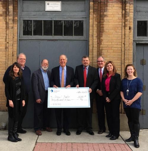 Skowhegan team presenting a check