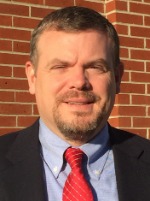 Man smiling in suit