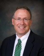 Man smiling in suit