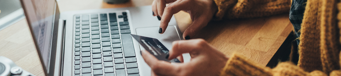 Woman paying for product online with a credit card