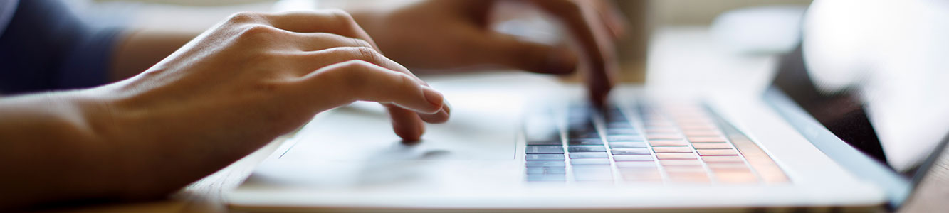 Person typing on a computer